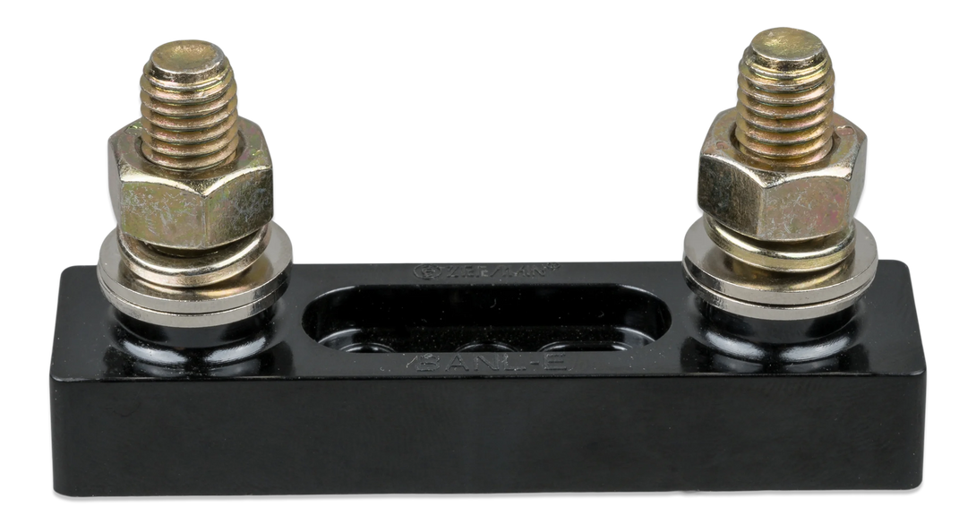 Black metal fuse holder with two brass bolts on a white background
